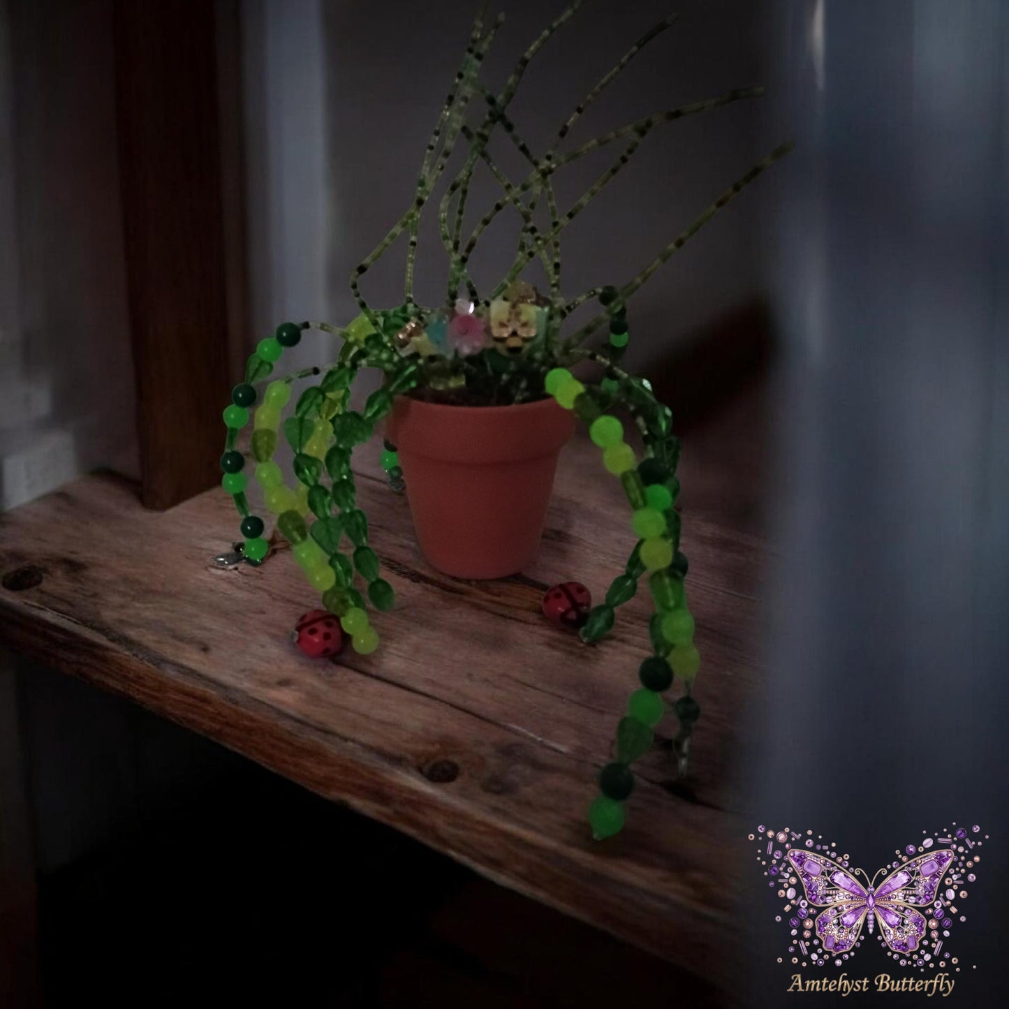 Glow-in-the-dark flower pot with charms.